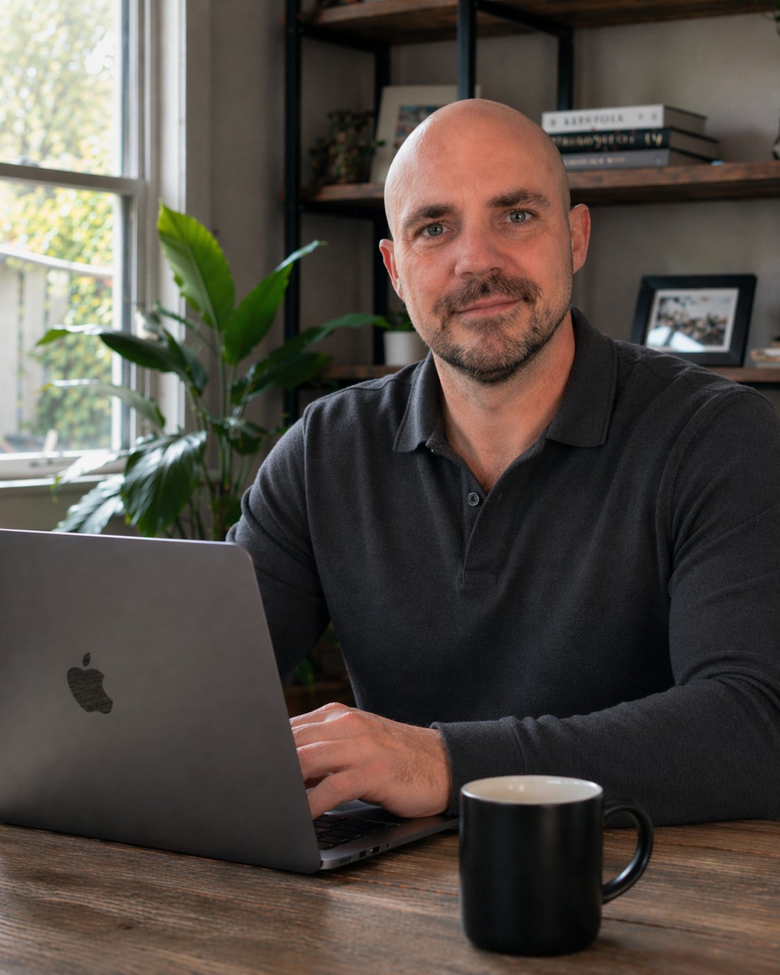 Justin Glover at his home office desk
